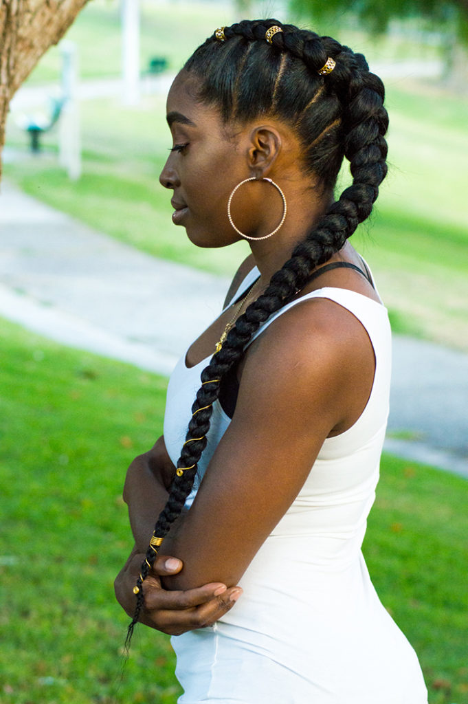 A woman with long hair and big braids.