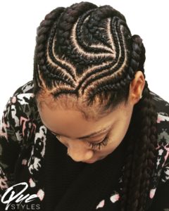 A woman with a mohawk hairstyle and a hair design.